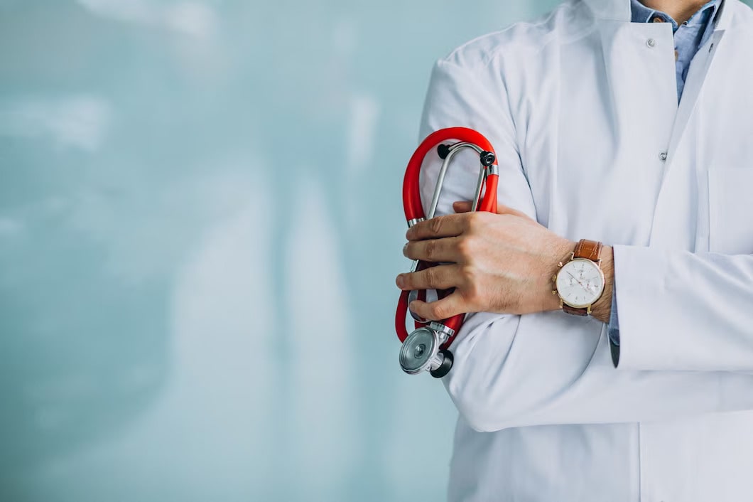 Young Physician with Medical Robe holding a Stethoscope