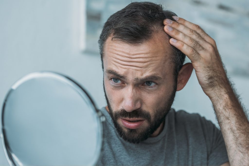 8 Ways to Relieve Postpartum Hair Loss, According to a Hair Loss Doctor