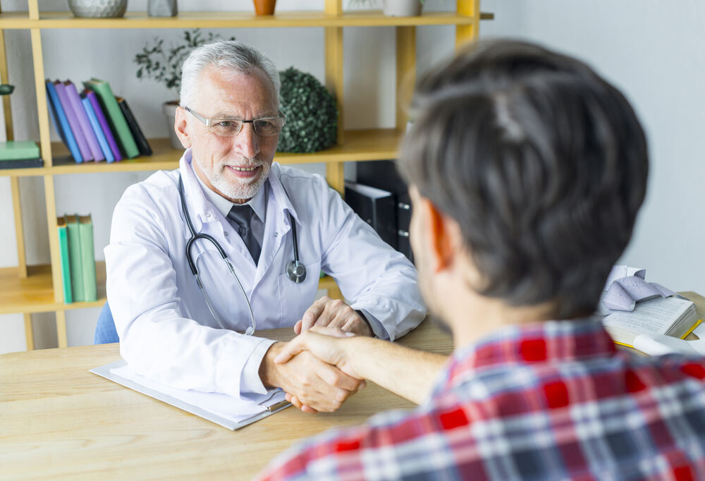 anonymous-patient-shaking-hand-doctor-1.jpg