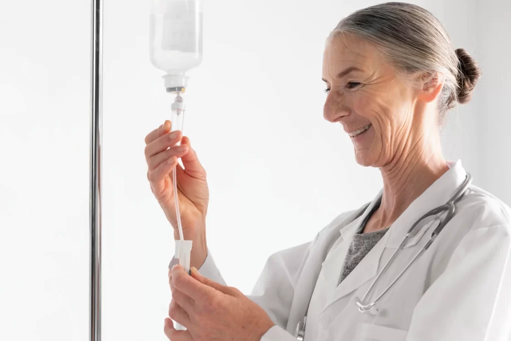 Smiling doctor preparing an IV drip in a bright hospital room