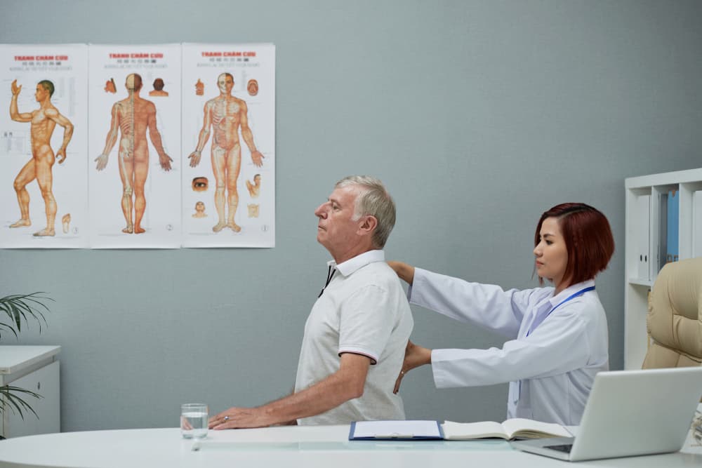 Physician check a guys back